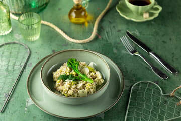 Gourmet Mushroom Risotto Served in Elegant Green Setting