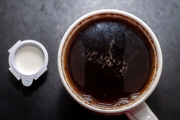 Detail of milk mixing in coffee drink, flat texture. Fresh beverages background