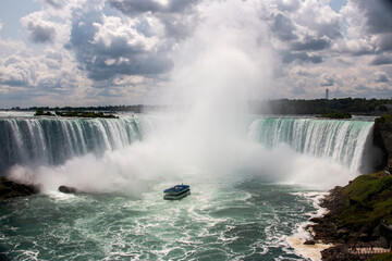 Experience the Power of Niagara Falls With a Boat Tour on a Sunny Day