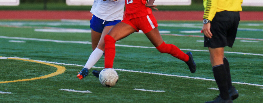 Exciting Soccer Match With Two Players Competing on the Field