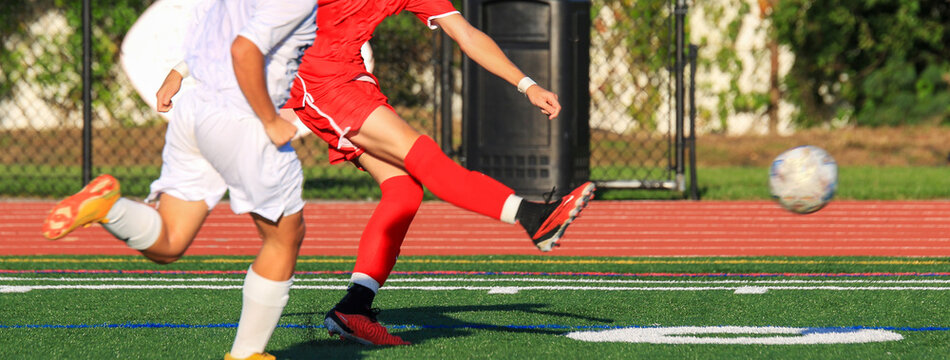Soccer Players Compete during a match