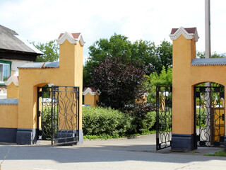 Open retro gates made of forged metal.