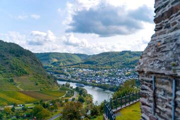 View of Cochem town and Moselle River from the castle wall, surrounded by green hills
