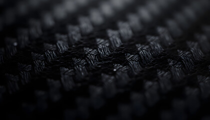 Obraz premium Close-up Macro View of a Black Carbon Fiber Weave Texture.