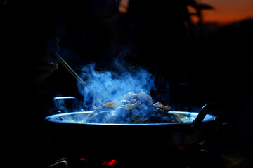 beautiful smoke of Thai BBQ buffet or Thai-style Barbecue in dark night