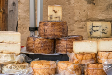 Food stall with variety of local cheese at Majorca farmers market Spain