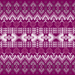 Intricate textile pattern featuring vibrant purple background with white geometric designs, showcasing traditional craftsmanship and cultural