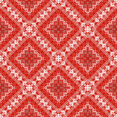 Intricate red and white geometric pattern featuring diamond shapes and floral motifs, creating vibrant and eye catching design