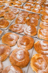 Traditional Majorcan ensaimadas pastries dusted with sugar at Palma market