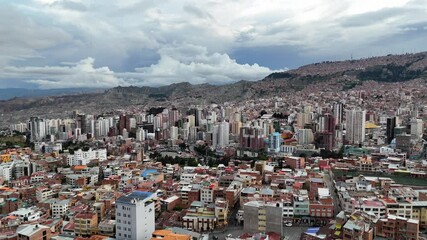 La Paz, Bolivia, aerial view flying over the dense, urban cityscape.