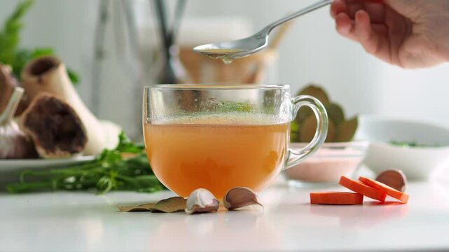 A drink of beauty and youth. The process of making fatty soup. Ingredients for bone broth. Soup set. Natural authentic simple food rich in trace elements. Beef bone broth.