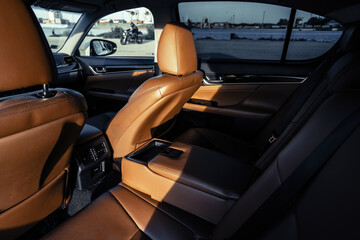 Riga, Latvia 05-09-2024 An inviting glimpse into the luxurious interior of a car, bathed in soft...