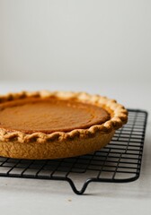A Whole Baked Pumpkin Pie on a Wire Rack