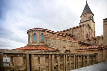 Exterior View of a Stone Church with Tower and Crosses. San Pedro church in Gijon, Asturias