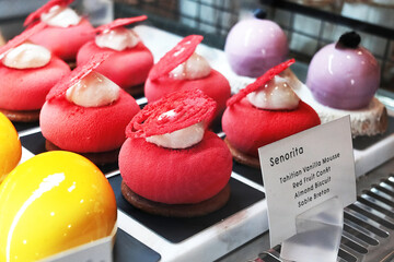 Homemade fresh vanilla mousse red fruit and almonds and chocolate biscuit in cafe