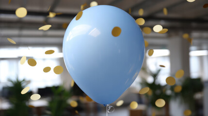 Blue balloon with golden confetti floating in office space celebrating employee birthday with festive atmosphere and blurred background