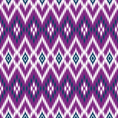 Seamless Ikat fabric pattern. The pattern looks dimensional and lively. Applications: Textiles, Fashion clothing, Tops, Skirts, Pants, Scarves, Bags, Curtains, Pillowcases, Sofa covers