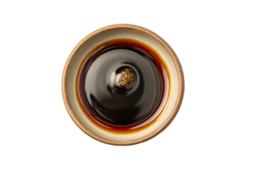 PNG Ceramic bowl filled with soy sauce and sesame seeds viewed from above
