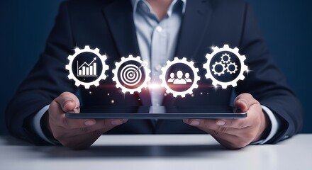 Businessman holding tablet with icons of growth chart, target, team, and gears, symbolizing business strategy and success.