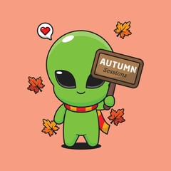 Cute alien holding autumn sign board in autumn day cartoon vector illustration