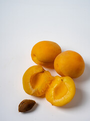Sweet cherries with apricots isolated on white background cutout. Ripe berries closeup. Mix berries and fruits.