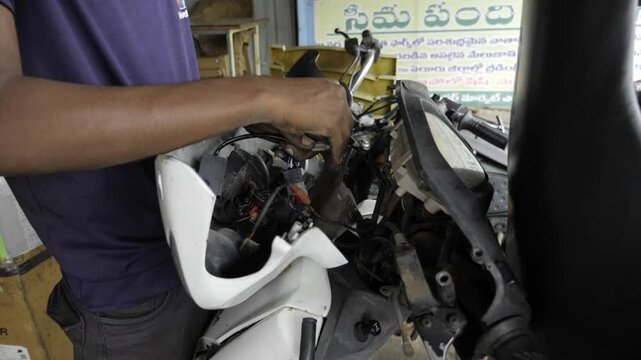 Expert Hand at Work - Troubleshooting Electrical Components