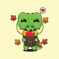 Cute crocodile holding a apple in wood bucket in autumn day cartoon vector illustration