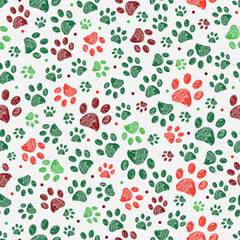 Green, red colored Christmas design doodle paw prints. Seamless fabric design pattern