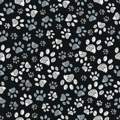 Grey colored doodle paw prints black background. Seamless fabric design pattern.eps