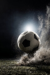 Naklejka premium Soccer ball with dirt particles frozen in mid air showcases incredible motion