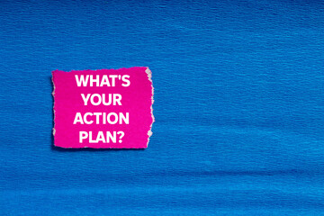 What's your action plan message written on ripped torn pink paper on blue background. Conceptual...