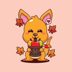 Cute kangaroo holding a apple in wood bucket in autumn day cartoon vector illustration