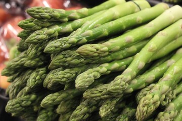 A bunch of asparagus sitting on top of a table