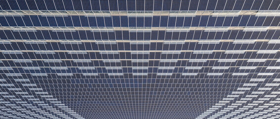 Greenhouse for growing vegetables with mounted photovoltaic solar panels on the roof, combining...