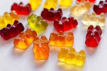 Colorful different Haribo gummy bears on white background