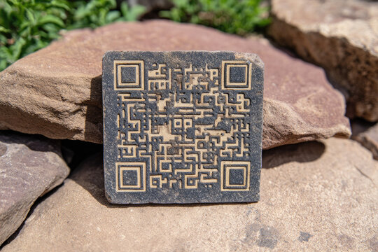 Ancient stone tablet with engraved QR code, blending traditional craftsmanship and modern digital technology, outdoors on natural rock background, symbolizing innovation
