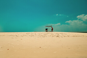View of people having fun on the beach at the Sand Bank in Funzi Island, Diani Beach, Kenya 
