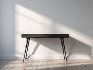 Modern black desk with tapered legs illuminated by natural light