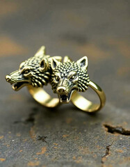 A close-up of a woman wearing a bird necklace