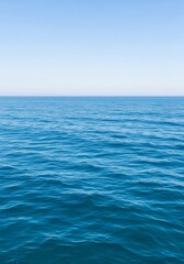 Serene Ocean Horizon - A tranquil of a calm ocean meeting a clear blue sky, perfect for backgrounds or travel themes