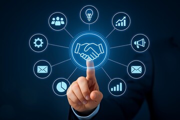 Hand touching a digital network of business icons representing partnership and growth
