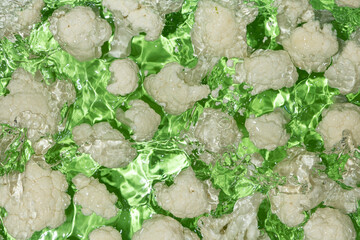 Artistic Cooking Background. Cauliflower in Water Top View, Water Splash