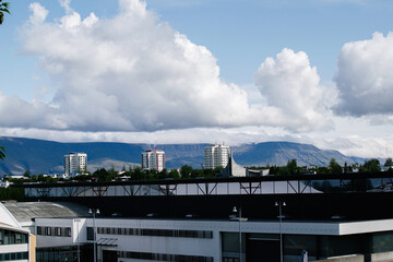 Scenic view of Reykjavik, Iceland architecture with mountains and clouds in background