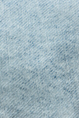 Macro Texture Background of Light Blue Jeans Material.