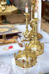 Crowns for church wedding on the altar in the church. Wedding ceremony.