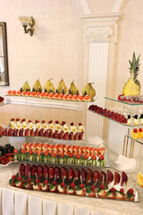 Beautiful sweet buffet with fruits and berries. Fruit table.