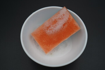 Vibrant culinary creation showcasing a colorful sponge soaking in bubbling liquid, perfect for adding flair to a sophisticated dish