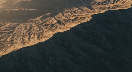 Fototapeta premium Majestic Mountain Landscape Aerial View of Rugged Terrain at Sunset