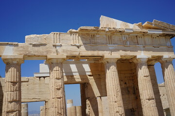 Exploring ancient architecture under the bright sun of Athens with magnificent columns showcasing timeless Greek heritage and culture in a historical landscape