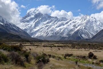A Vast Wilderness Meets Towering Peaks under a Sky of Blue